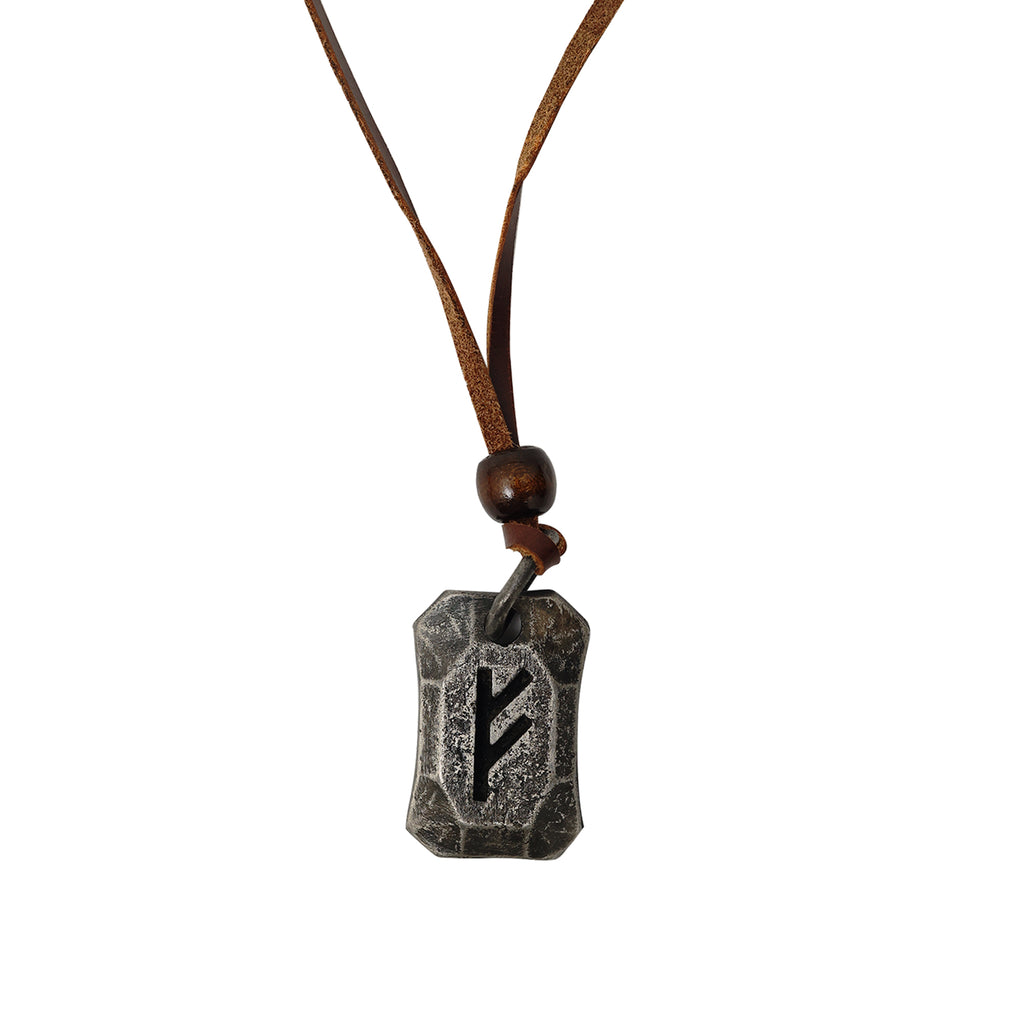 The Viking Rune Pendant Fehu features a black rune symbol on a weathered, irregular rectangular pendant hanging from a brown leather cord with a wooden bead, inspired by Norse mythology.