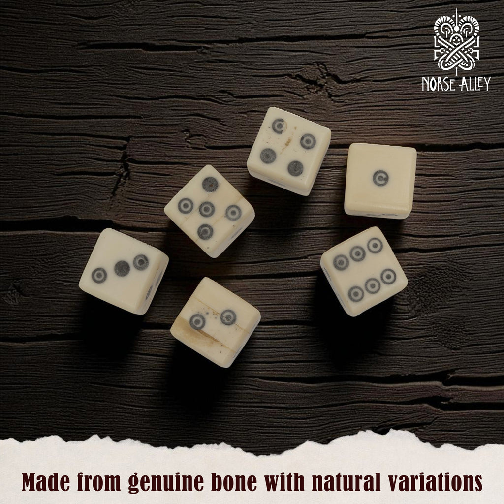 Six Viking style, handcrafted bone dice with black dots and natural markings are displayed on a dark wood surface. Text: "Bone Dice – Set of 6, crafted from genuine bone with natural variations." Norse Alley logo in top right corner.
