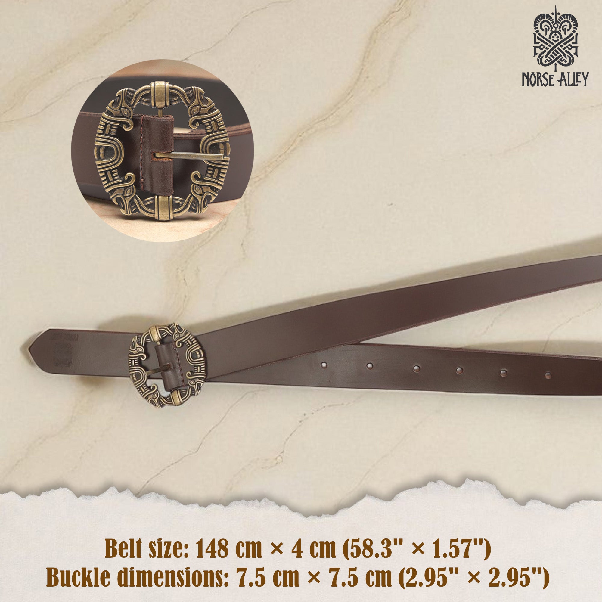 The Norse Alley The Drakkar Belt is a brown Viking leather belt (148×4 cm) featuring a large, round, ornate 7.5 cm metal buckle with intricate Norse designs and the Norse Alley logo in the corner.