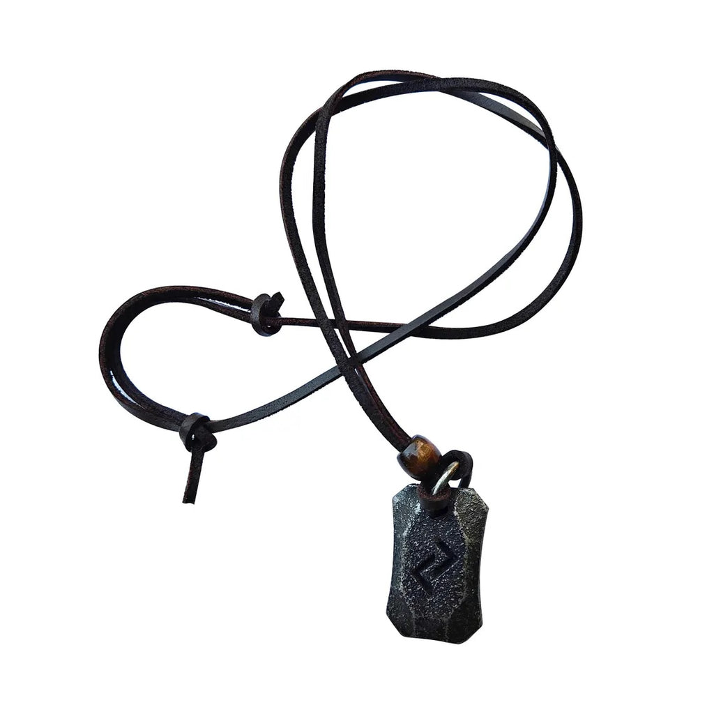 The Viking Rune Pendant Jera features a dark, rectangular stone engraved with the Jera rune from Norse mythology, hanging on a black leather cord and shown against a white background.