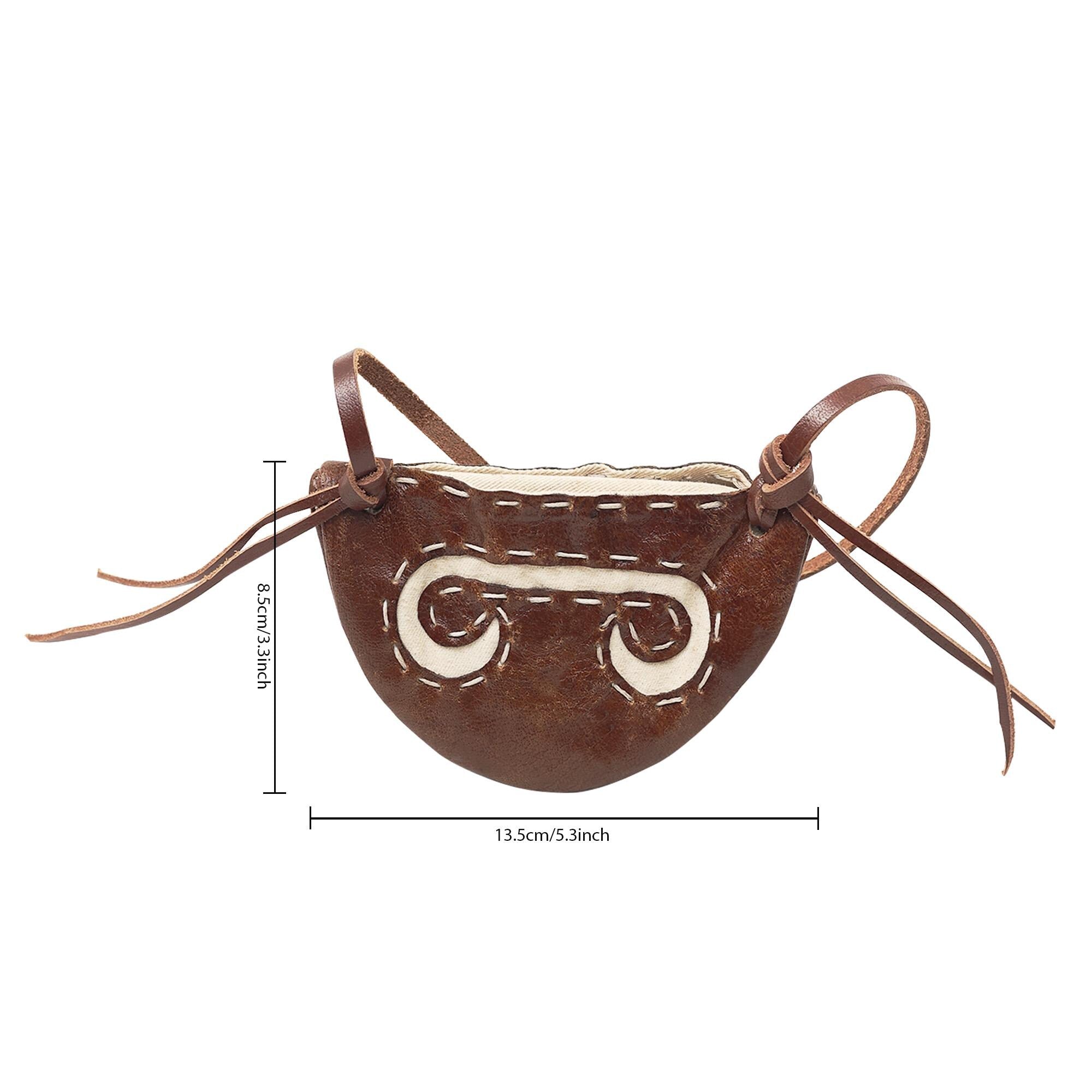 The Gokstad Wallet Viking Coin Pouch is a small, brown handcrafted leather wallet with white stitching, two tie straps, and measures 13.5cm x 8.5cm—a perfect accessory for carrying coins in true Viking style.