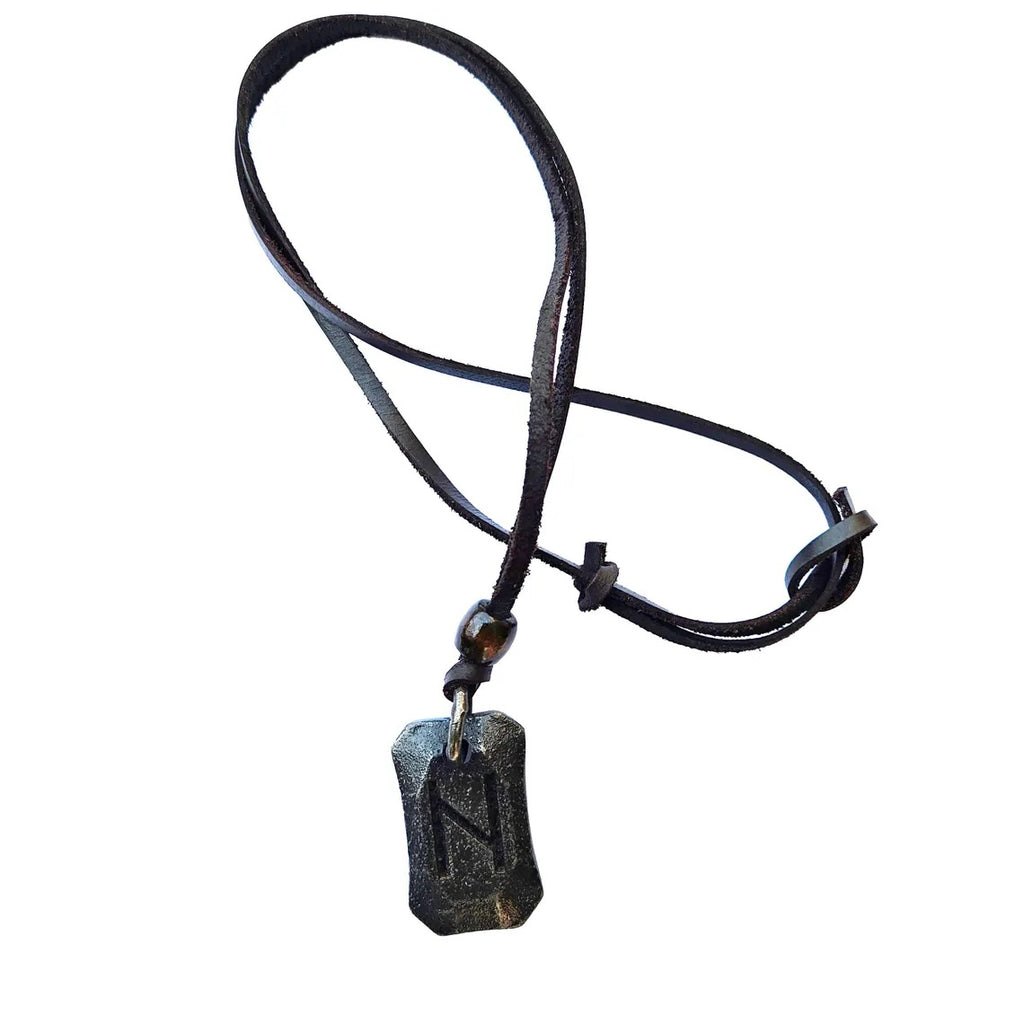 The Viking Rune Pendant Hagalaz features a rectangular, weathered metal pendant engraved with the Norse Hagalaz rune, hanging on a black leather cord with adjustable knots for sizing.