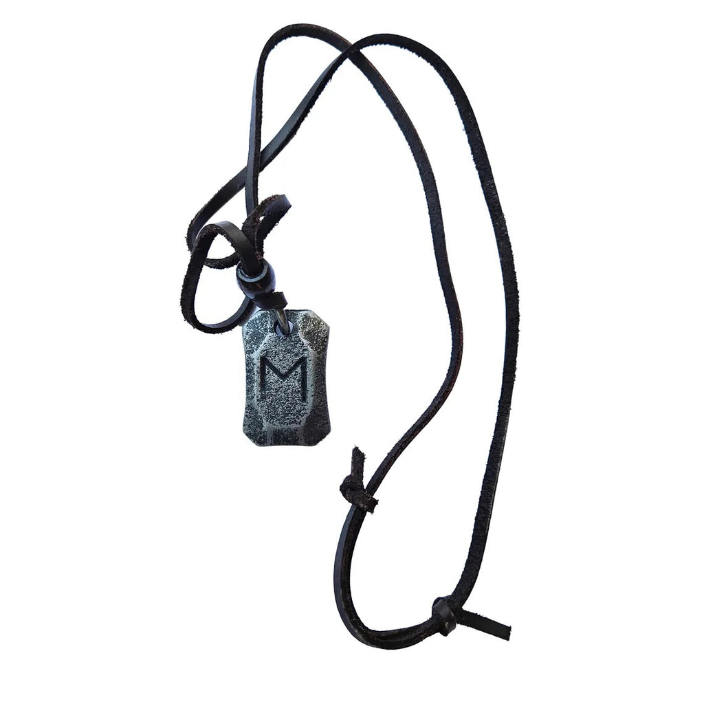 The Viking Rune Pendant Ehwaz features a stone-like gray pendant engraved with the letter M (Ehwaz rune) on a black cord necklace, finished with simple knotted ends.