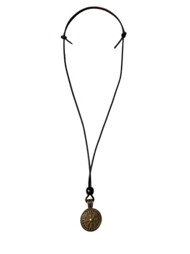 The Traveler’s Compass Pendant Necklace features a thin black cord and a round, bronze-colored pendant with intricate patterns, shown on a white background.
