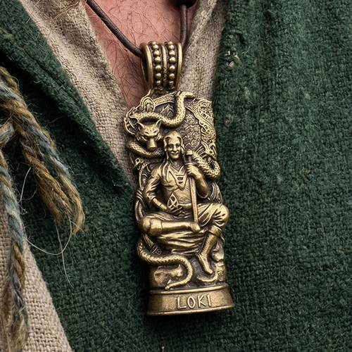The Loki Pendant – The Trickster God is a solid brass talisman featuring Norse god Loki seated with a serpent and wolf above. "LOKI" is engraved at the bottom, making this Norse mythology jewelry a striking piece.